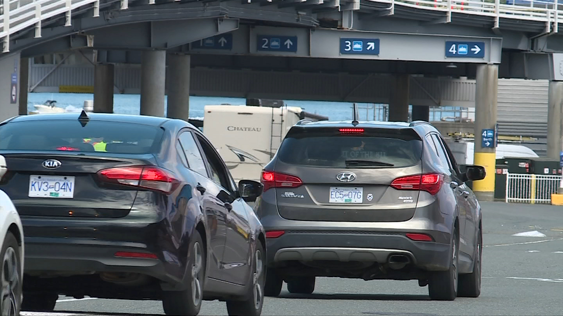 Cars loading onto ferry at terminal