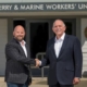 Colin Laird and Harry Cameron shaking hands