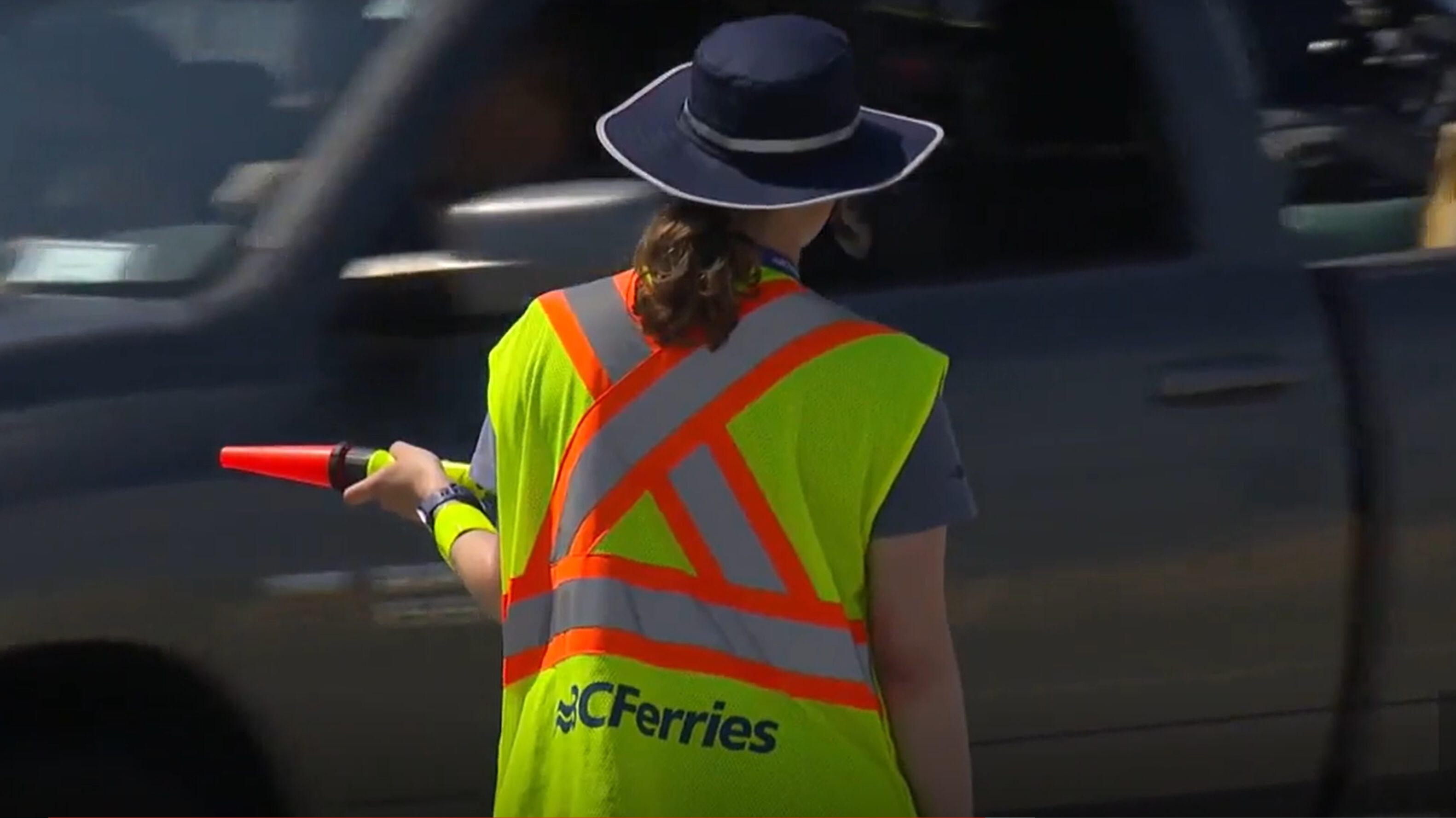 BC Ferries worker directing traffic