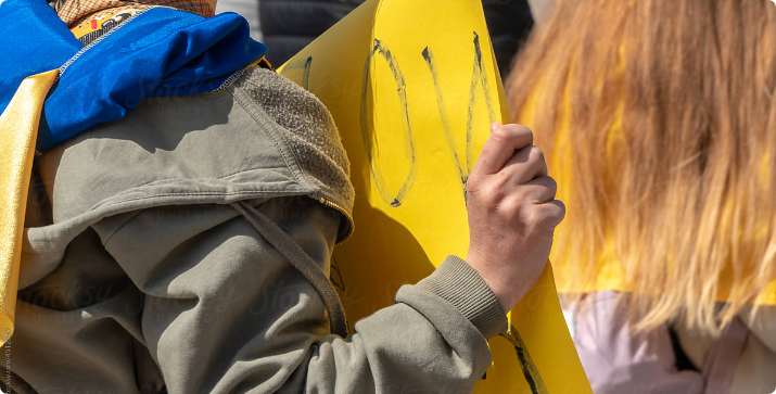 Someone holding sign
